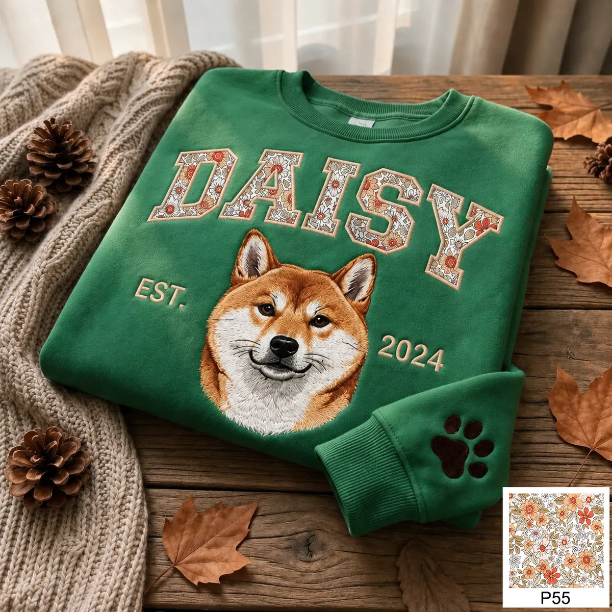 Pink sweatshirt with CHARLIE in light blue floral letters above an embroidered French bulldog