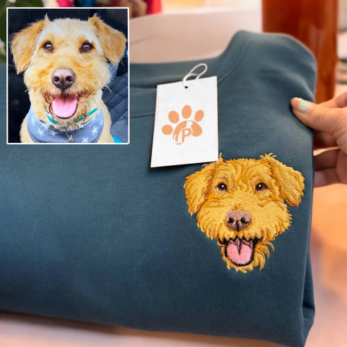 Full-color embroidered terrier face on a teal sweatshirt, shown next to the dog's photo