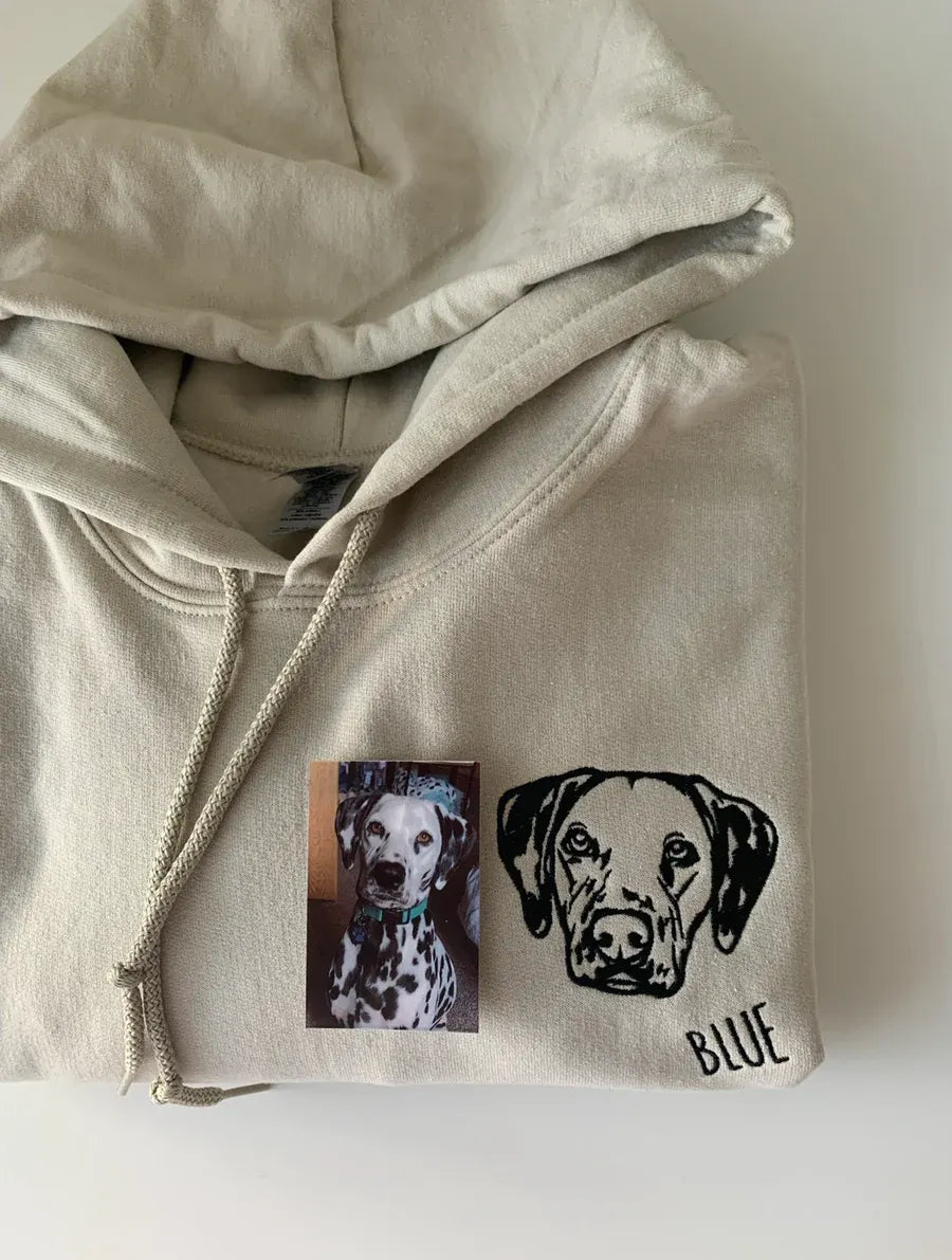 Sand hoodie with an embroidered Dalmatian outline and the name Blue