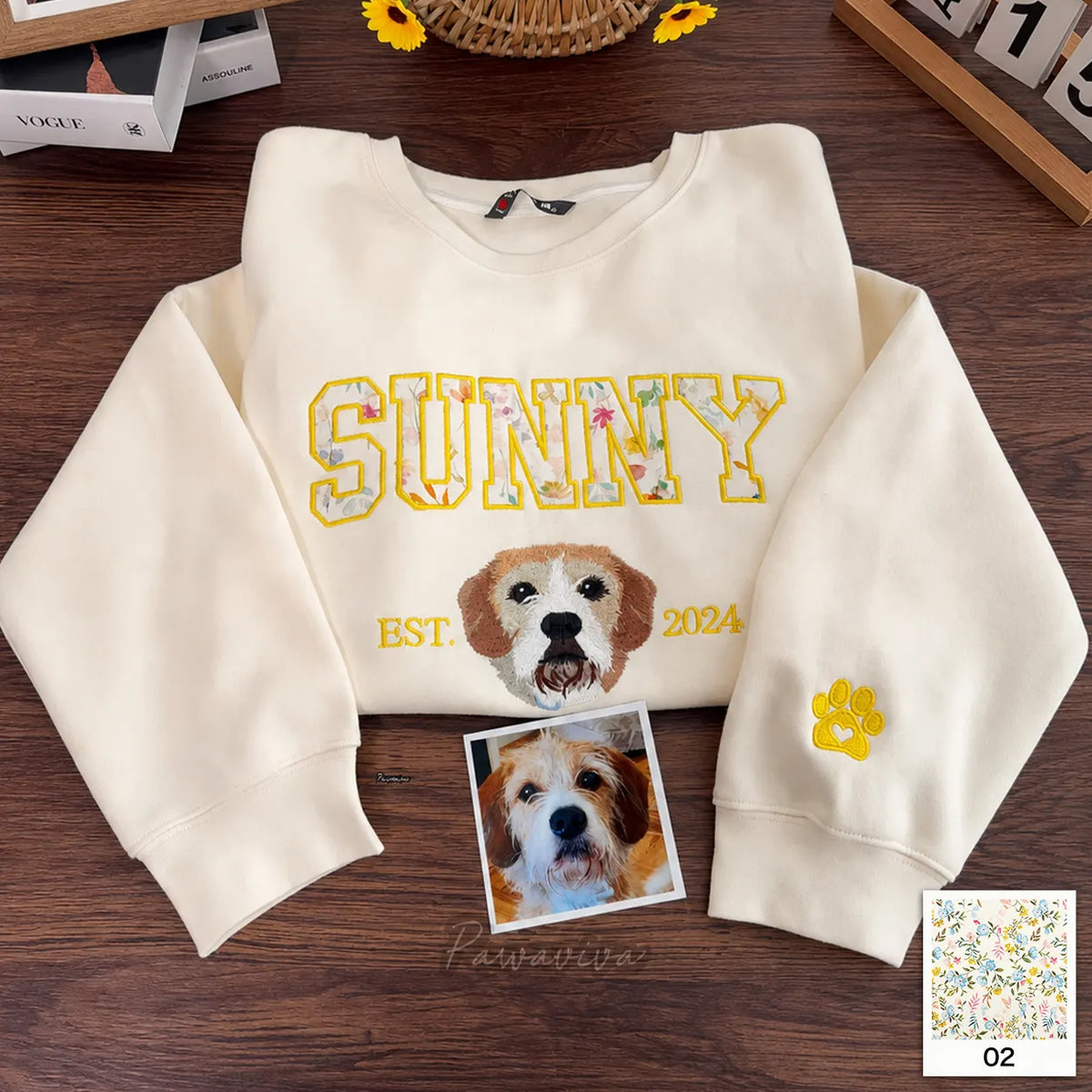 Green sweatshirt with DAISY in floral appliqué letters above an embroidered shiba inu