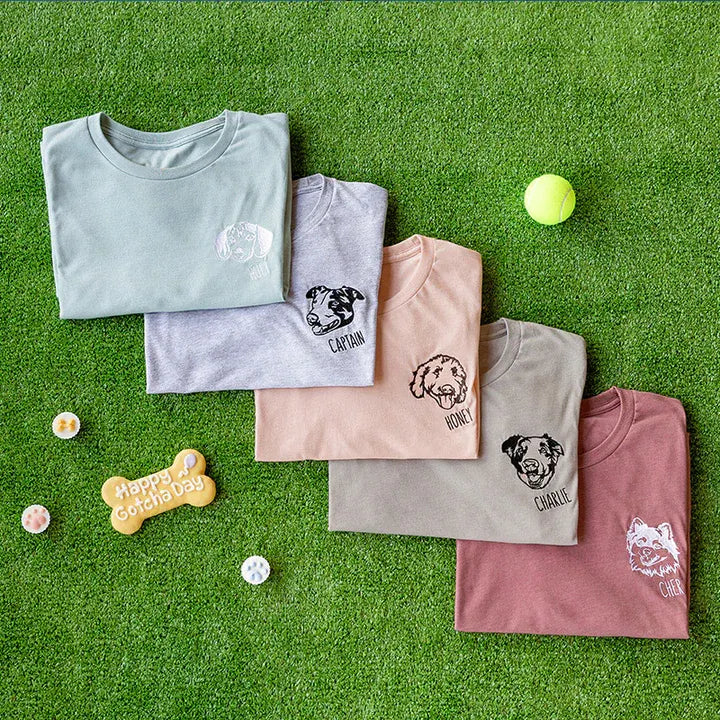 Five pepper-color T-shirts with small line art dog portraits embroidered on the left chest