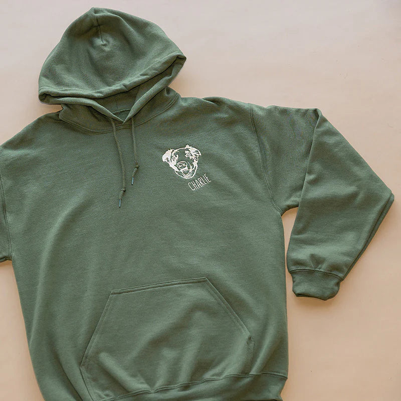 Military green hoodie with a white thread dog outline and the name Charlie on the left chest