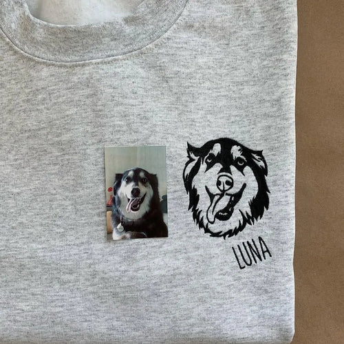 Black outline husky portrait embroidered on a gray sweatshirt with the name Luna, next to the pet photo