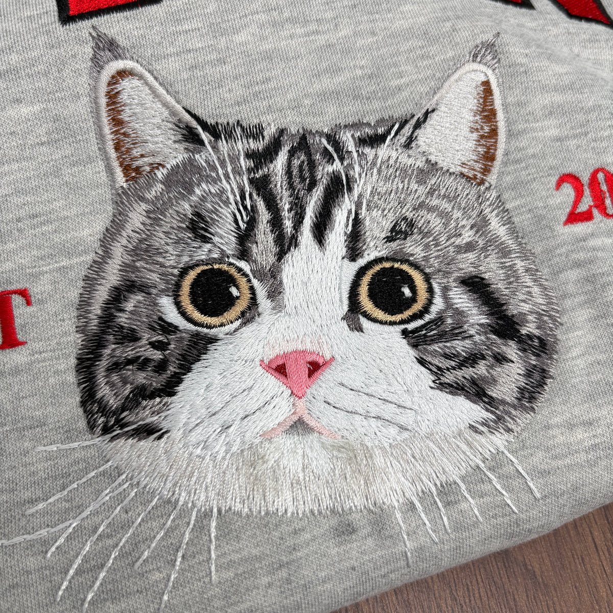 Custom embroidered pet portrait sweatshirt with name and EST year