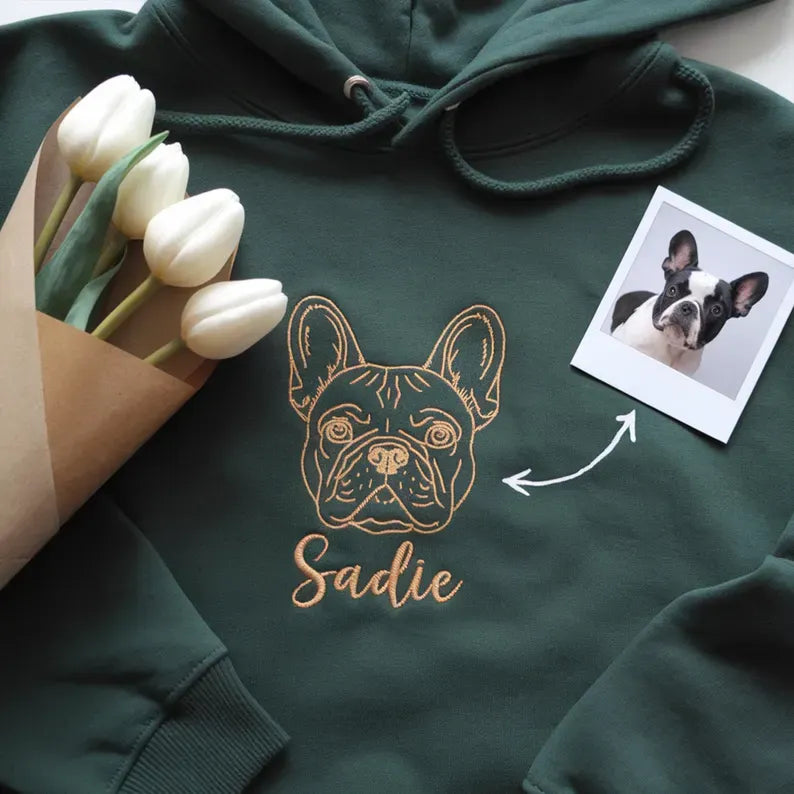 Forest green hoodie with a gold thread French bulldog outline and Sadie in script