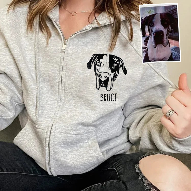 Gray personalized pet portrait zip hoodie worn by a model
