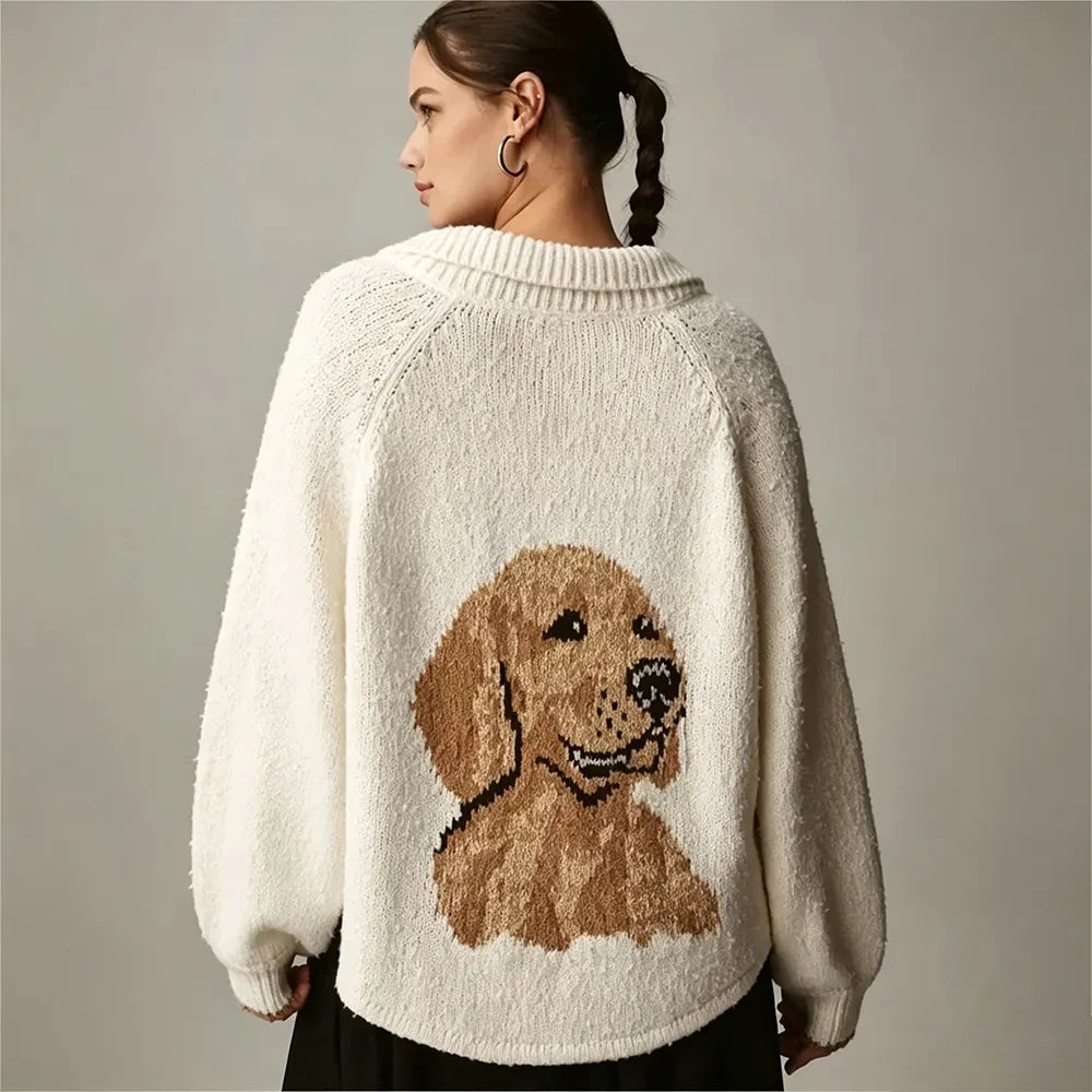 Side view of a model in an ivory cardigan with a golden retriever knitted on the back